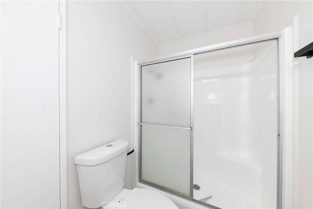 40975 Laredo Trail Cherry Valley, CA 92223 - Photo 11 of 34 a white toilet sitting next to a shower
