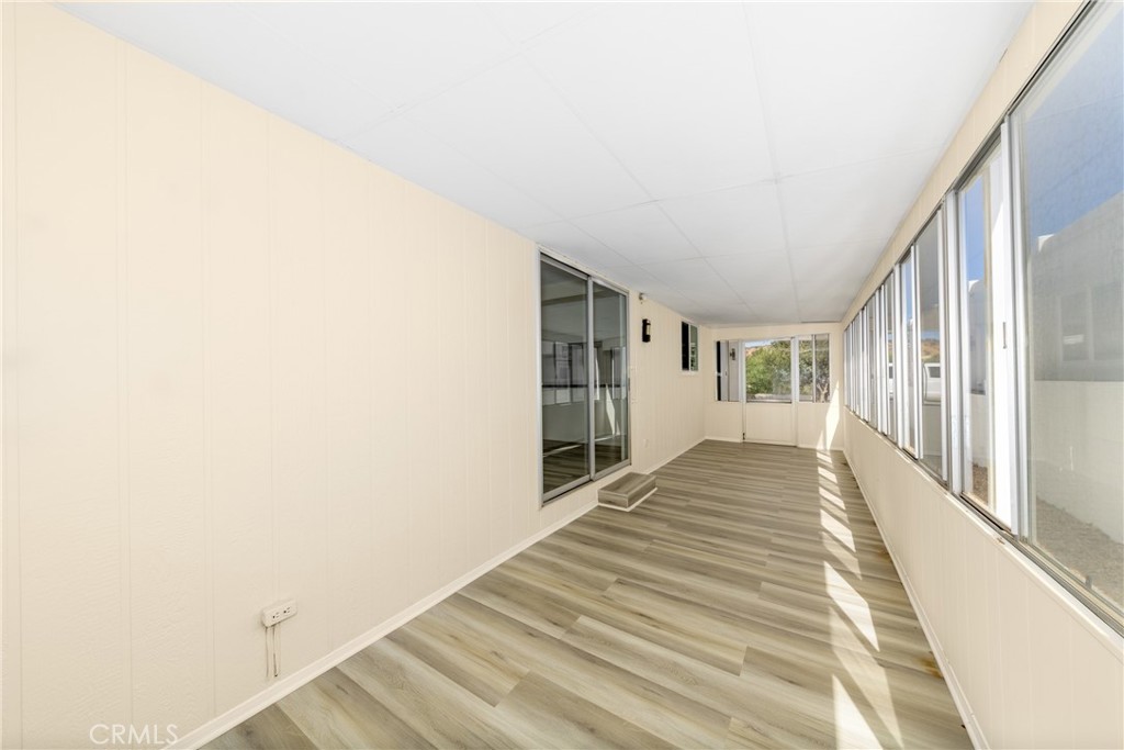 40975 Laredo Trail Cherry Valley, CA 92223 - Photo 24 of 34 a view of a bedroom with wooden floor and stairs