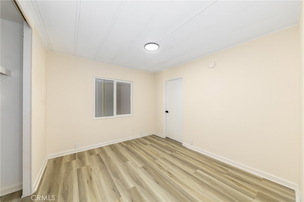 40975 Laredo Trail Cherry Valley, CA 92223 - Photo 25 of 34 a view of a room with wooden floor