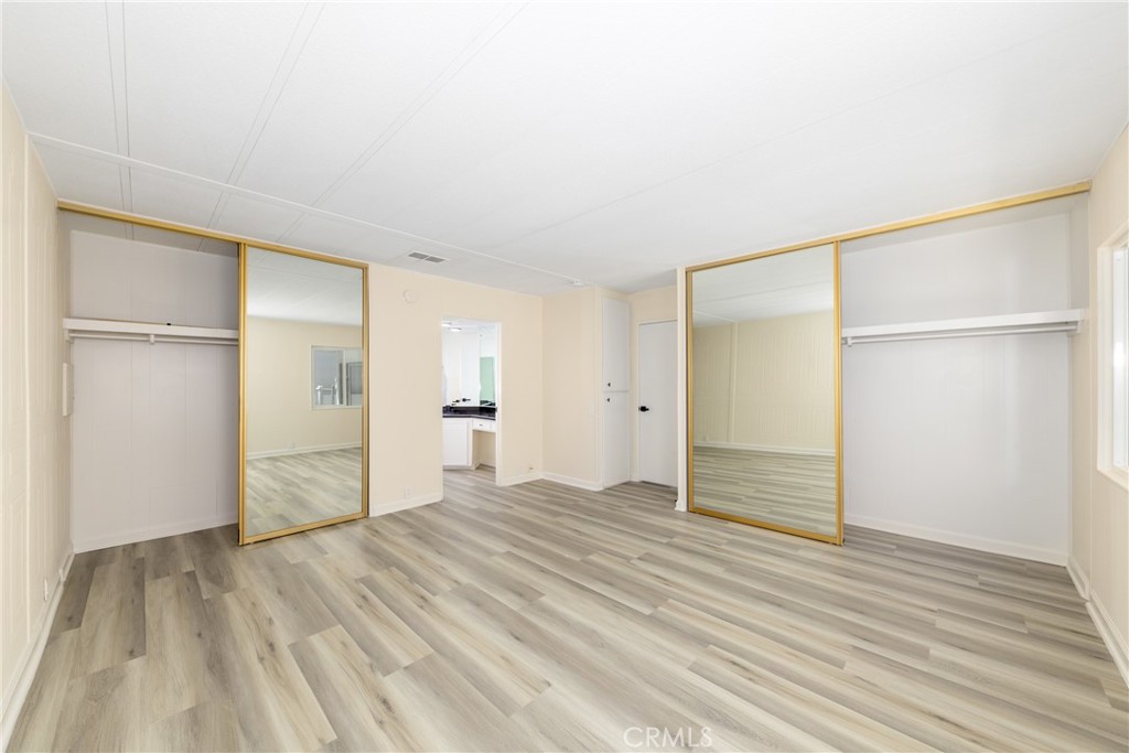 40975 Laredo Trail Cherry Valley, CA 92223 - Photo 28 of 34 a view of empty room with wooden floor