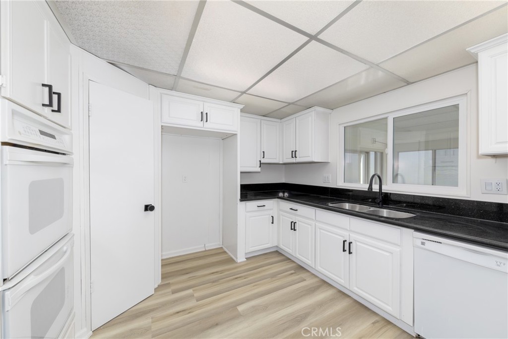 40975 Laredo Trail Cherry Valley, CA 92223 - Photo 6 of 34 a kitchen with granite countertop a sink and cabinets