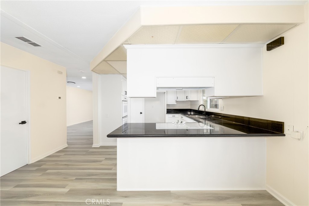 40975 Laredo Trail Cherry Valley, CA 92223 - Photo 7 of 34 a kitchen with a sink and a stove top oven