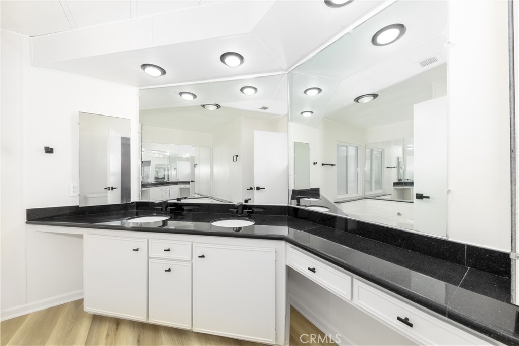 40975 Laredo Trail Cherry Valley, CA 92223 - Photo 9 of 34 a kitchen with granite countertop a sink and cabinets