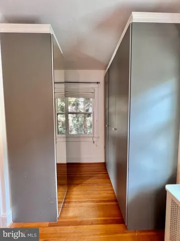 a bathroom with a sink mirror and vanity