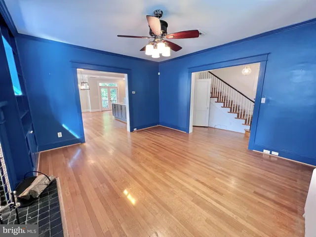 a view of livingroom with hardwood floor and a ceiling fan