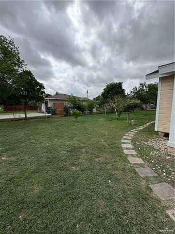 a view of a field with sitting area