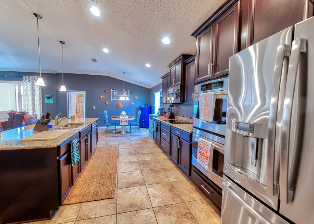 95199 Windflower Trail Fernandina Beach, FL 32034 - Photo 11 of 29 a large kitchen with stainless steel appliances lots of counter space