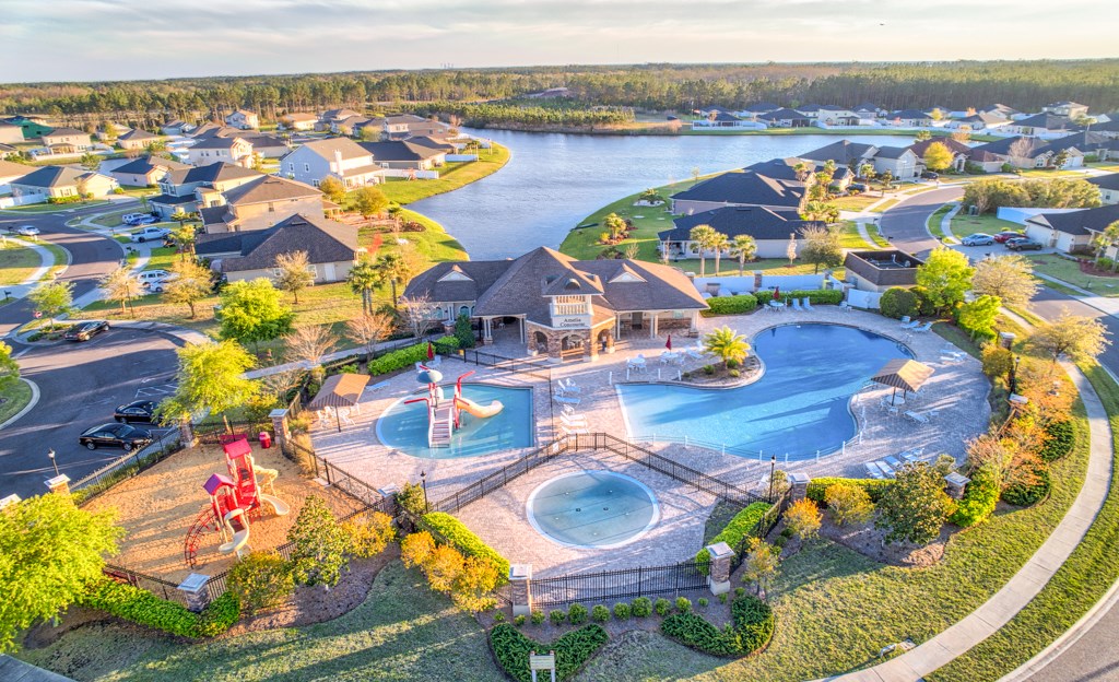 95199 Windflower Trail Fernandina Beach, FL 32034 - Photo 2 of 29 an aerial view of a swimming pool patio and mountain view