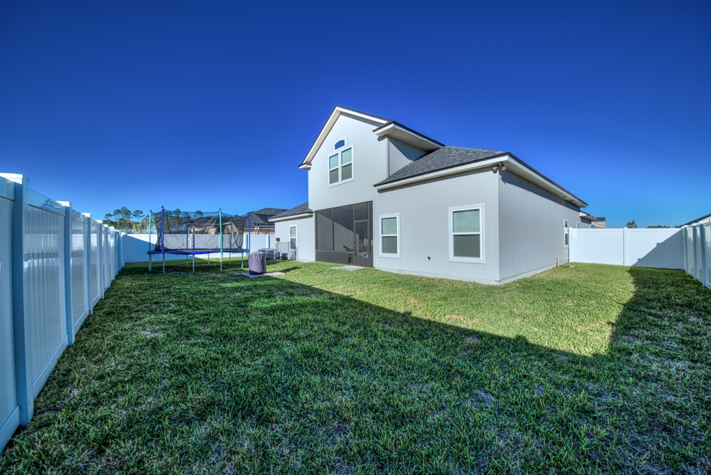 95199 Windflower Trail Fernandina Beach, FL 32034 - Photo 26 of 29 a view of a house with backyard and garden