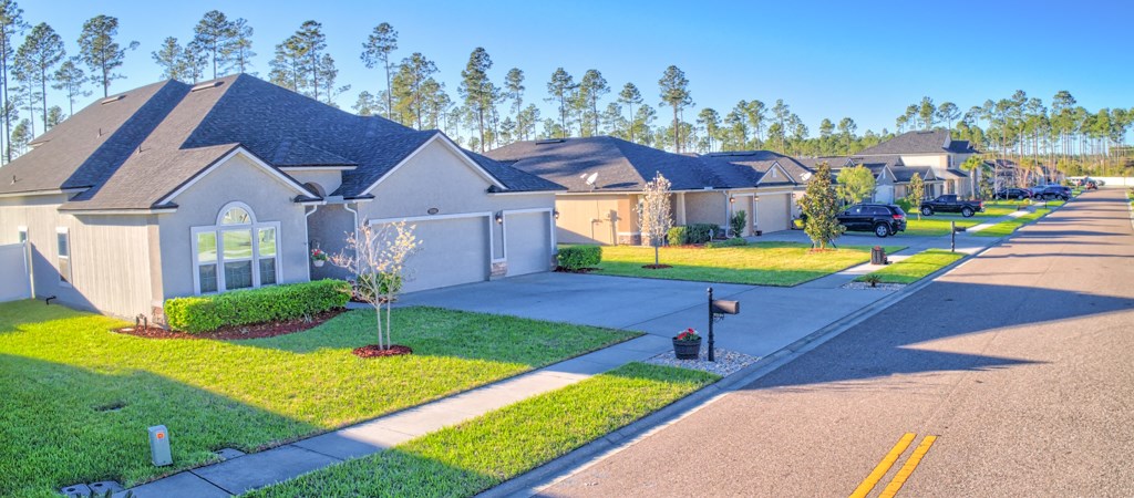 95199 Windflower Trail Fernandina Beach, FL 32034 - Photo 3 of 29 a view of a house with a swimming pool