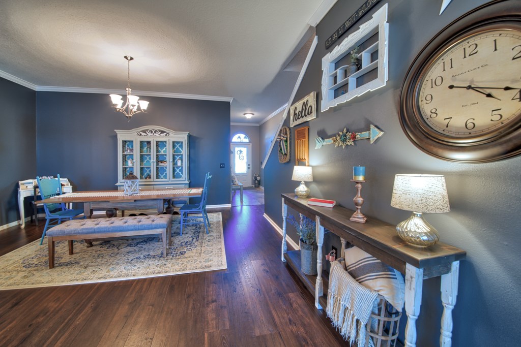95199 Windflower Trail Fernandina Beach, FL 32034 - Photo 7 of 29 a living room with furniture a chandelier and wooden floor