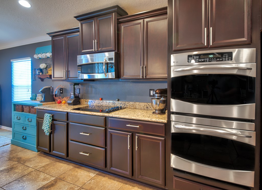 95199 Windflower Trail Fernandina Beach, FL 32034 - Photo 10 of 29 a kitchen with granite countertop stainless steel appliances and wooden cabinets