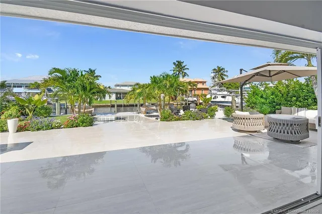 a view of front door and potted plants