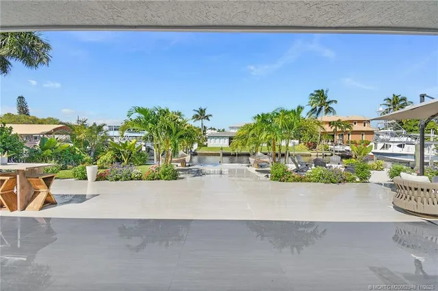 a view of a swimming pool and outdoor seating