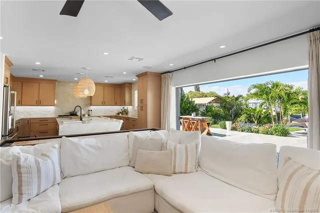 a bedroom with a bed and a ceiling fan