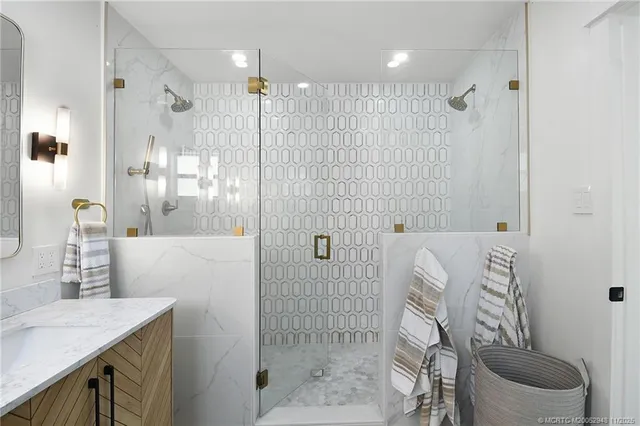 a bathroom with a glass shower door