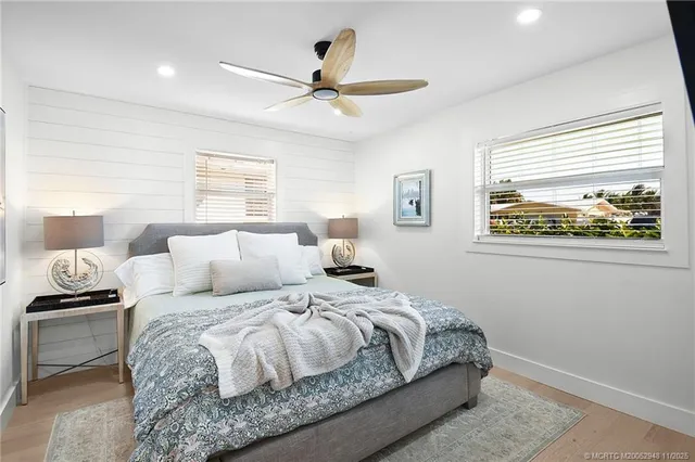a bathroom with a double vanity sink mirror and shower