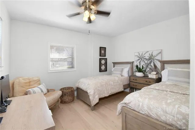an aerial view of a house with garden space and street view