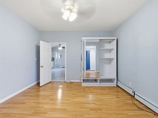 a view of room with wooden floor and chair