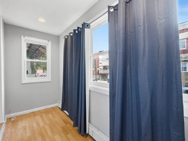 a view of a bathroom with a shower curtain