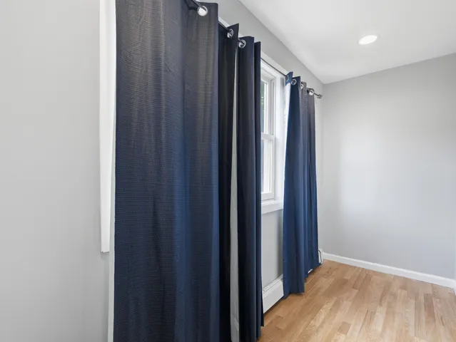 a view of a house with a snow on the road