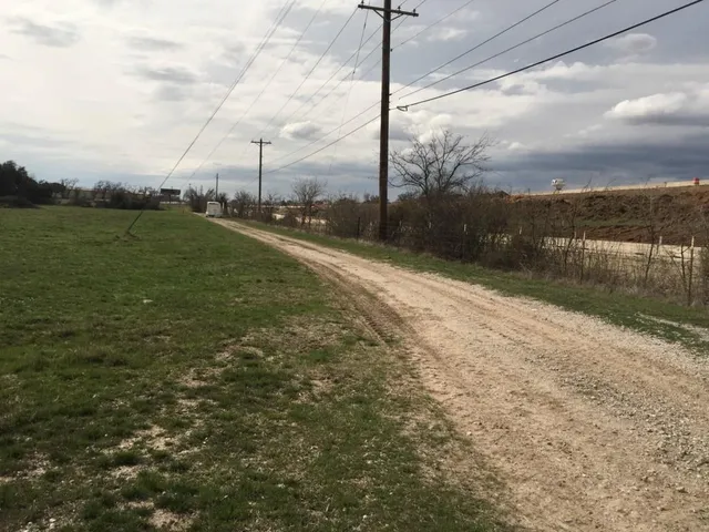 a view of a road with a yard