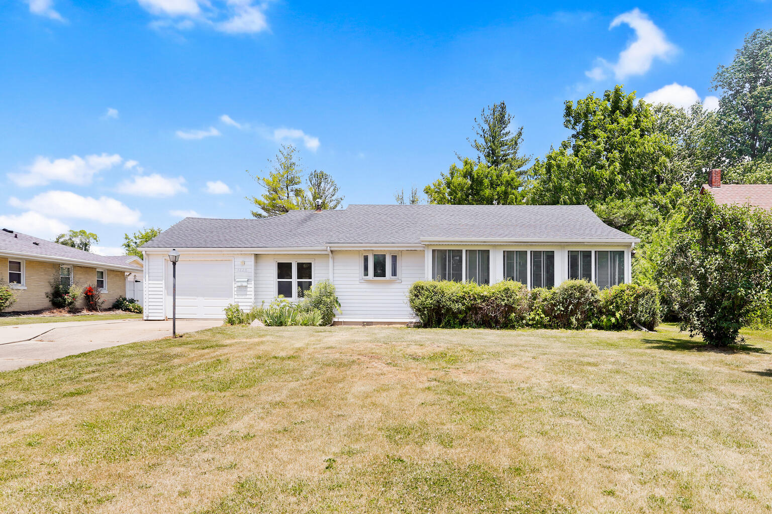1220 West Semor Drive Decatur, IL 62521 - Photo 1 of 27 a front view of a house with a yard