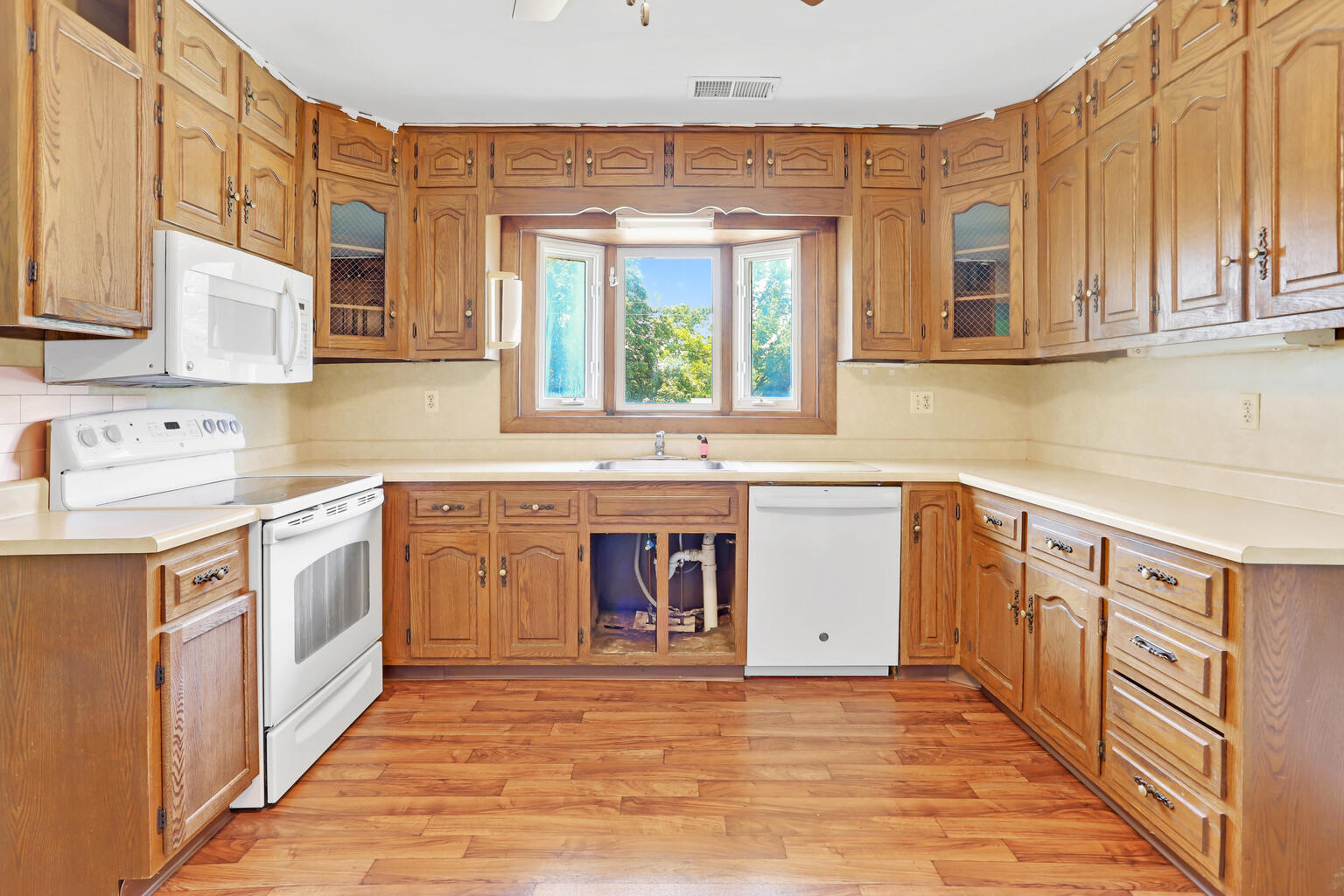 1220 West Semor Drive Decatur, IL 62521 - Photo 11 of 27 a kitchen with stainless steel appliances granite countertop a stove and a sink
