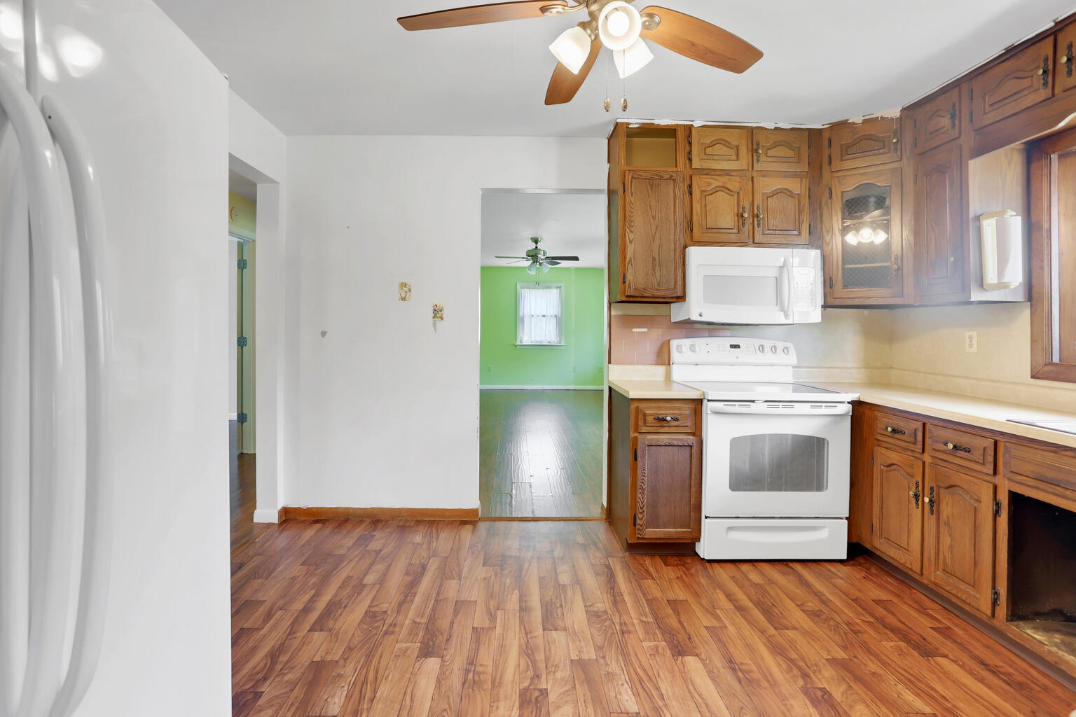 1220 West Semor Drive Decatur, IL 62521 - Photo 12 of 27 a kitchen with a stove a sink and a refrigerator