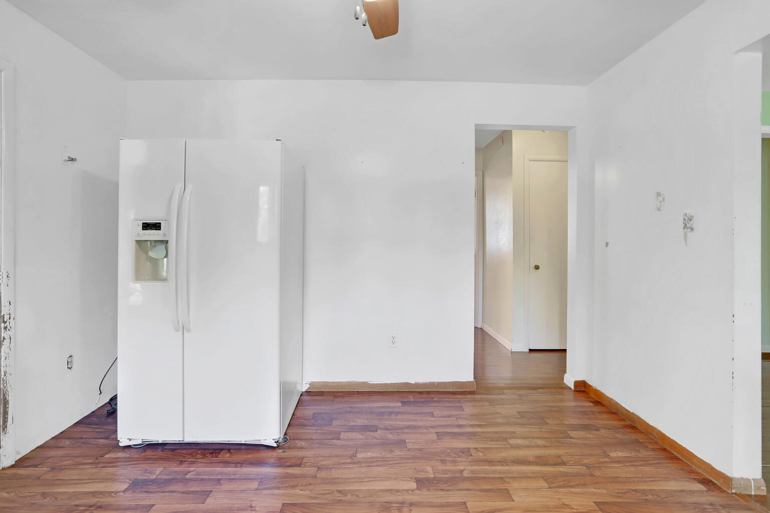1220 West Semor Drive Decatur, IL 62521 - Photo 13 of 27 a view of an empty room with wooden floor
