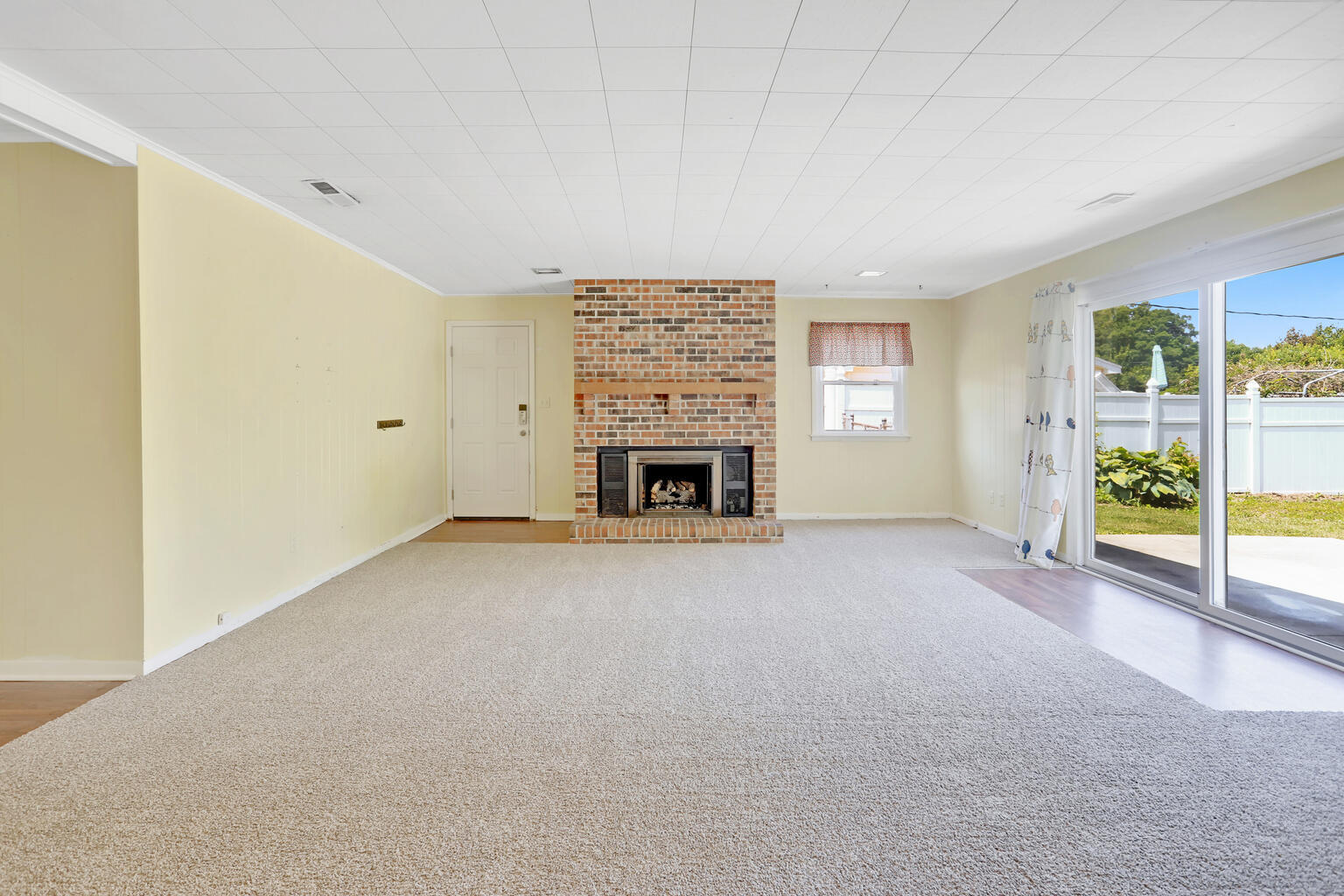1220 West Semor Drive Decatur, IL 62521 - Photo 16 of 27 a view of an empty room with a fireplace