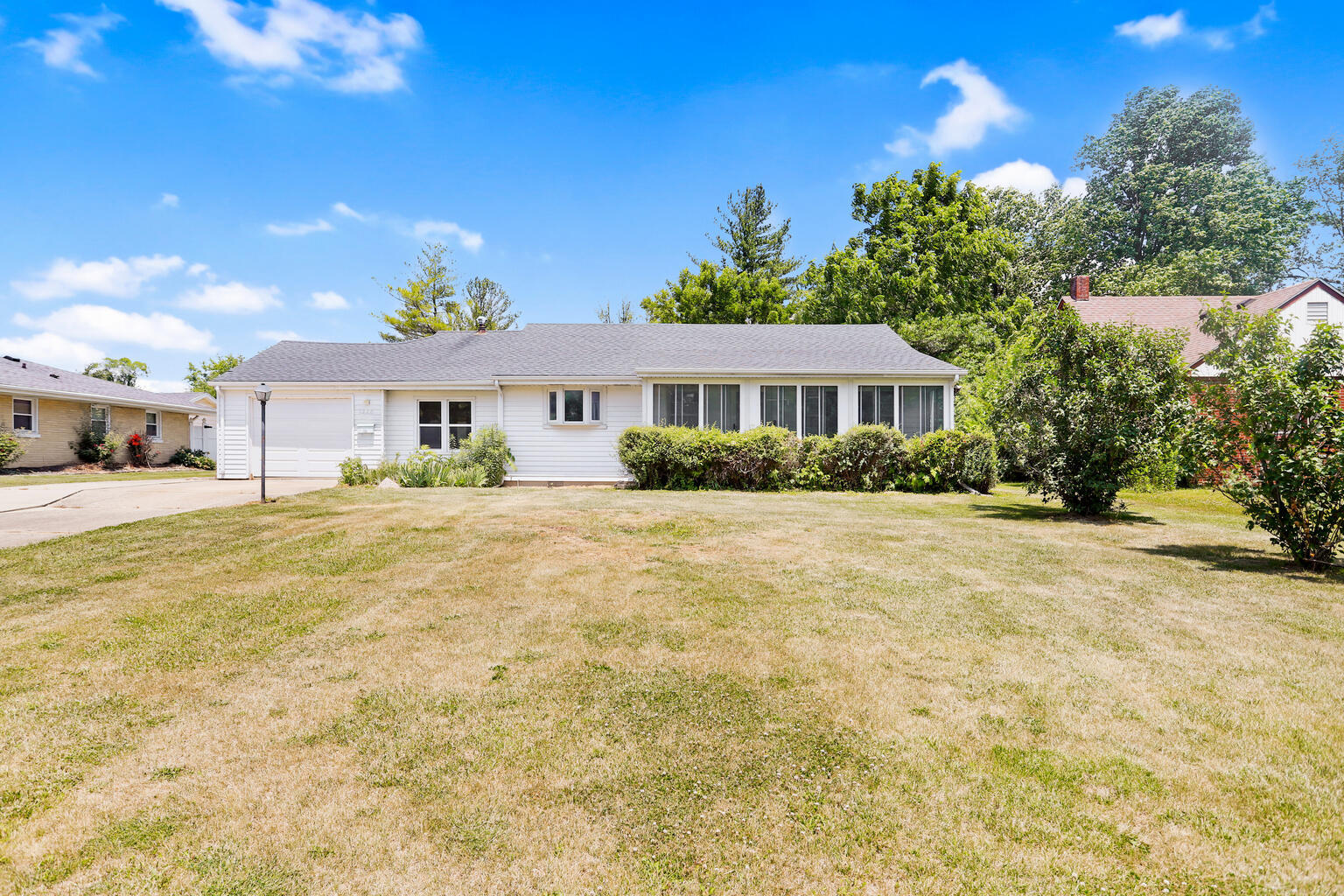 1220 West Semor Drive Decatur, IL 62521 - Photo 2 of 27 a front view of a house with a yard