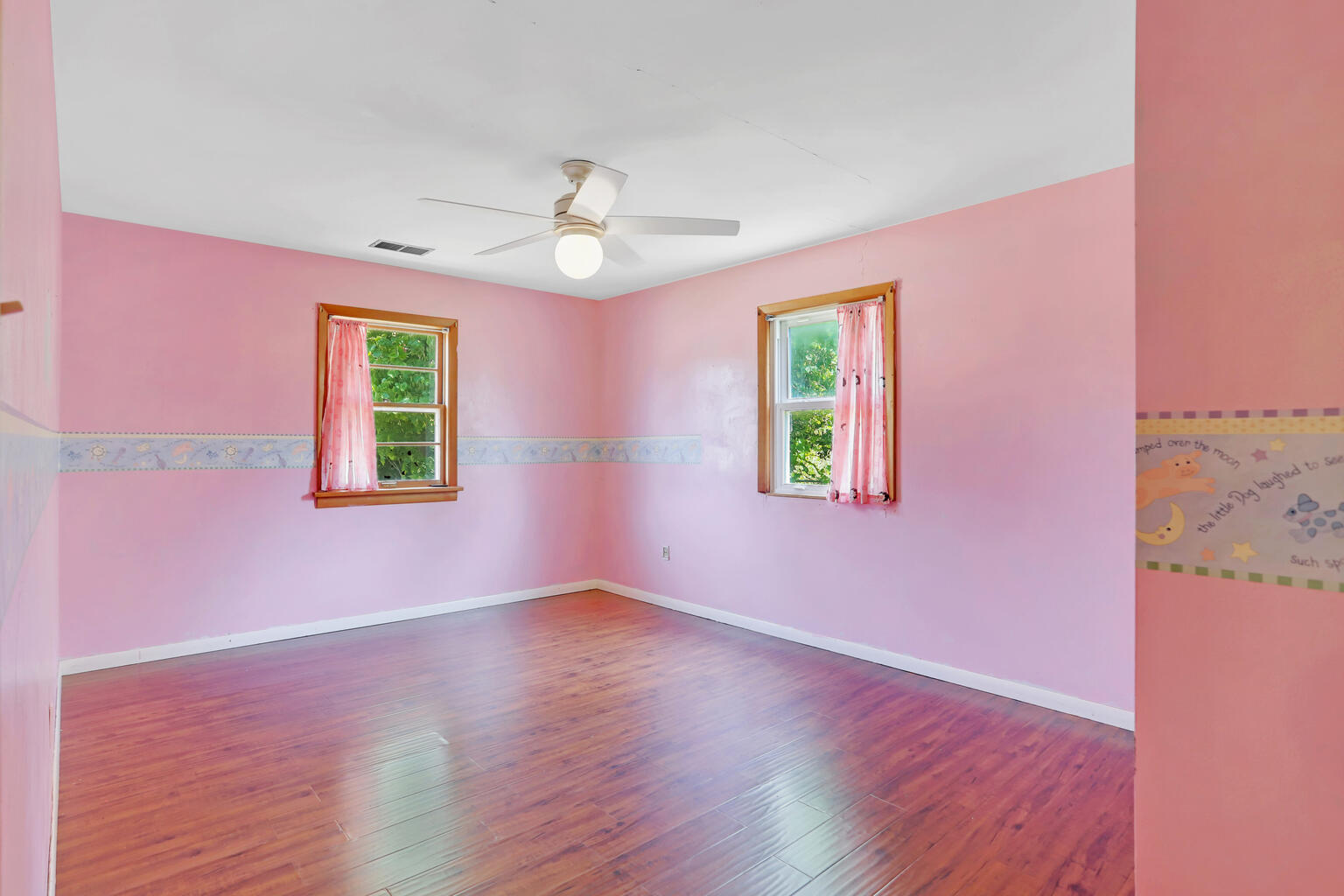 1220 West Semor Drive Decatur, IL 62521 - Photo 25 of 27 a view of an empty room with window and wooden floor