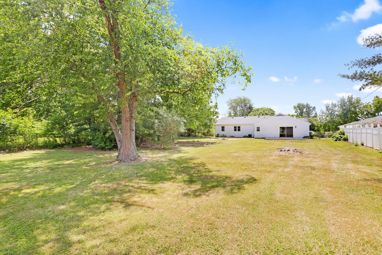 1220 West Semor Drive Decatur, IL 62521 - Photo 6 of 27 a house view with a trees in the background