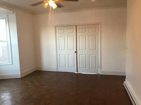 32 Wamesit Street, Unit 2 Lowell, MA 01852 - Photo 6 of 9 an empty room with a empty space and windows