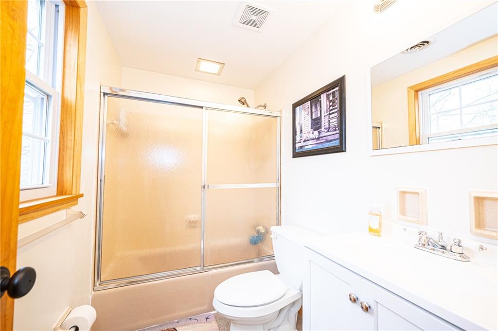 111 Valley View Road Eighty Four, PA 15330 - Photo 19 of 25 GUEST BATH: 8 X 411: Ceramic Tile Flooring, White Vanity with Storage, Porcelain Tile Shower, Neutral Porcelain Bathtub, New Solid Wood Doors, New Solid Wood Trim, Natural Light, Fresh Neutral Paint