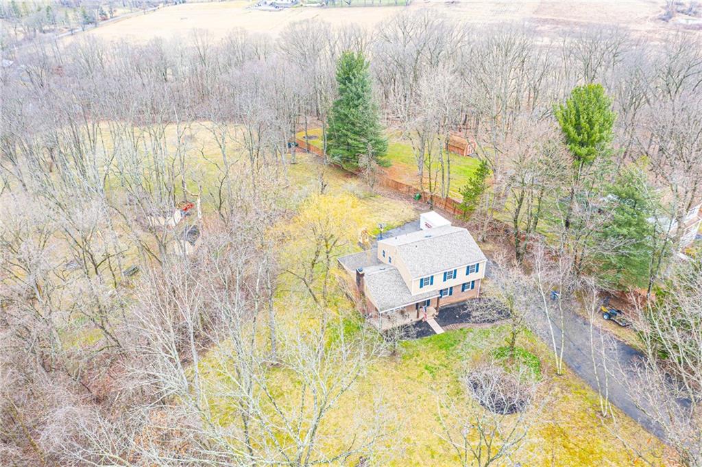 111 Valley View Road Eighty Four, PA 15330 - Photo 24 of 25 EXTERIOR: 3.5 Acres: New Vinyl Siding, Brick Faade, New Shutter, New Double-Pane New , Construction, Anderson Windows with Built-in Muttons, New Roof, New Gutters and Downspouts, New Soffit and Fascia, Two Freshly Painted Sheds, Newly refinished Privacy Fence, 15-20 Car Driveway, 2500 Gallon Cistern, Optional 200-foot Well, Septic System (Maintained by Hapchuk)