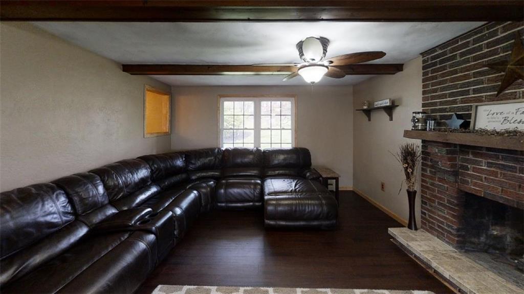111 Valley View Road Eighty Four, PA 15330 - Photo 9 of 25 FAMILY ROOM: 234 X 135: New Bamboo Hardwood Flooring, New Ceiling Fans (2), New Solid Wood Trim, Brick Wood-Burning Fireplace, Rustic Wood Beams, Sliding Glass Doors to Screened Porch, Fresh Neutral Paint