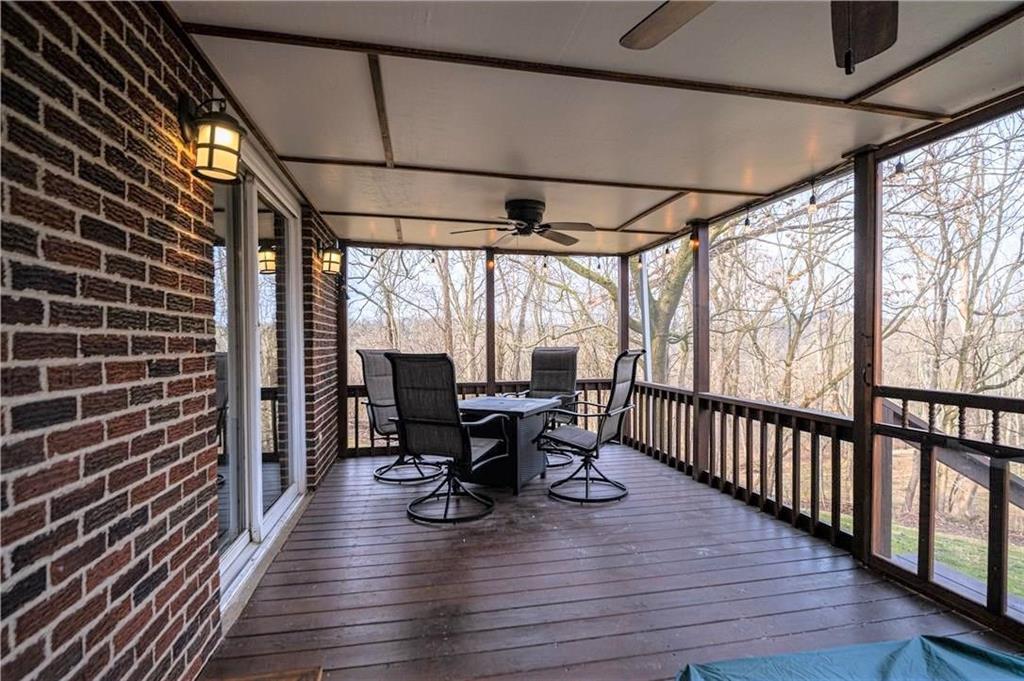 111 Valley View Road Eighty Four, PA 15330 - Photo 10 of 25 SCREENED PORCH: 207 X 102: Fully Screened, Access to Yard, New Ceiling Fans (2), Custom-Built Water Feature, Lighting