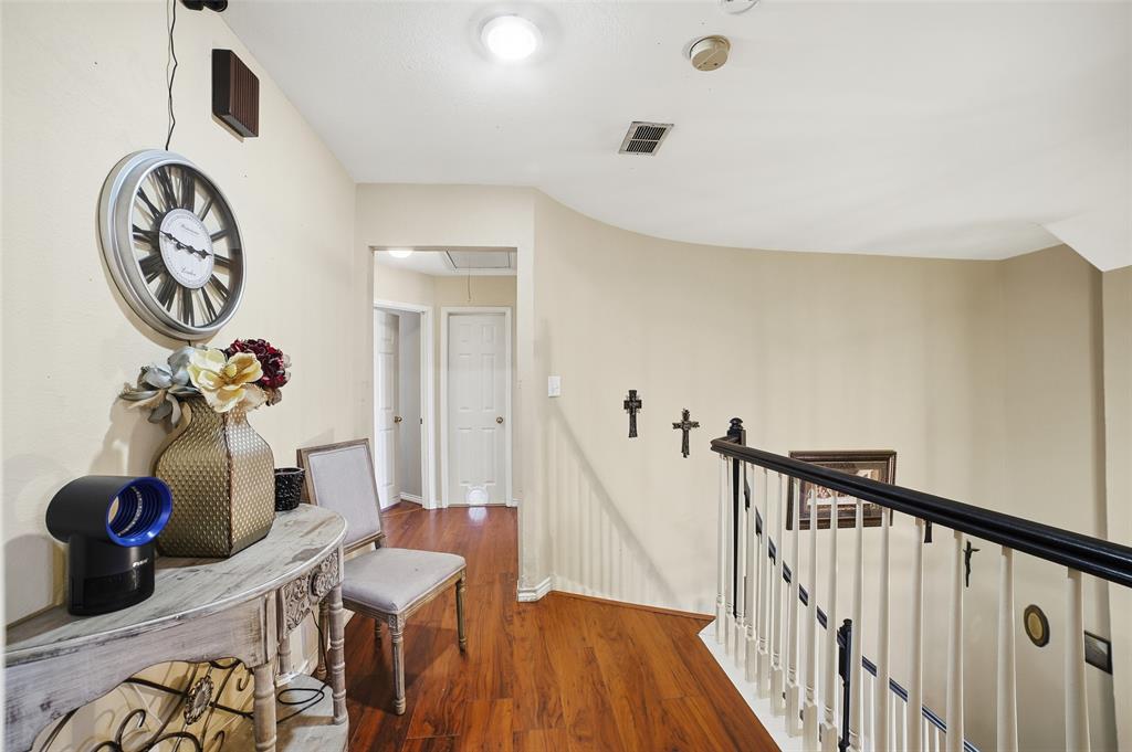 3613 Bermuda Drive Rowlett, TX 75088 - Photo 19 of 35 a view of a hallway with paintings on the wall