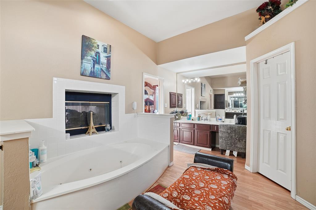 3613 Bermuda Drive Rowlett, TX 75088 - Photo 23 of 35 a bathroom with a tub sink and mirror