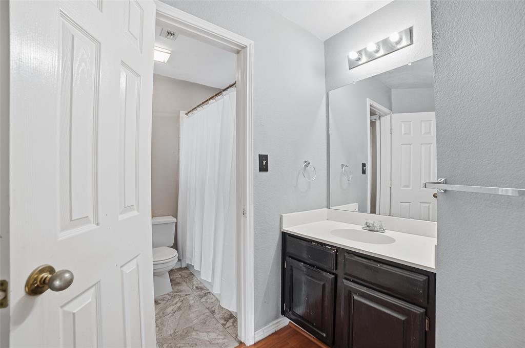 3613 Bermuda Drive Rowlett, TX 75088 - Photo 25 of 35 a bathroom with a sink a mirror and a shower