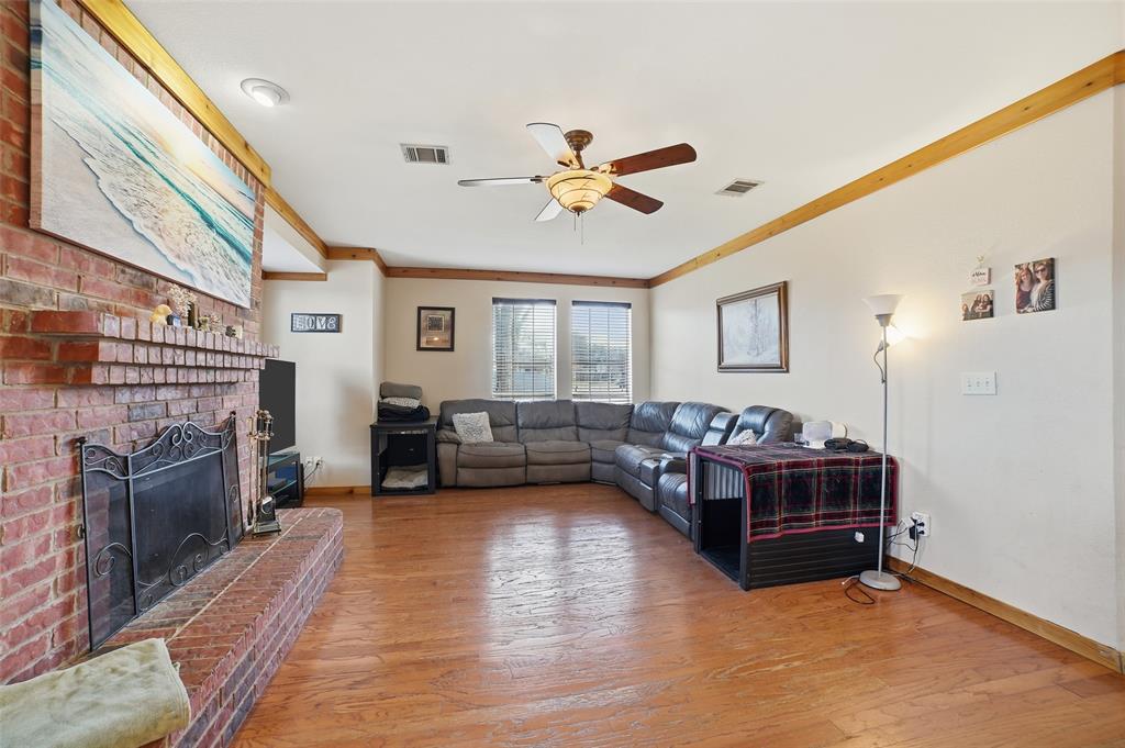 3613 Bermuda Drive Rowlett, TX 75088 - Photo 10 of 35 a living room with fireplace furniture and a flat screen tv
