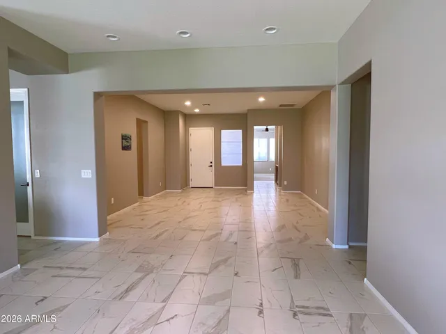 a kitchen with a refrigerator and a stove top oven