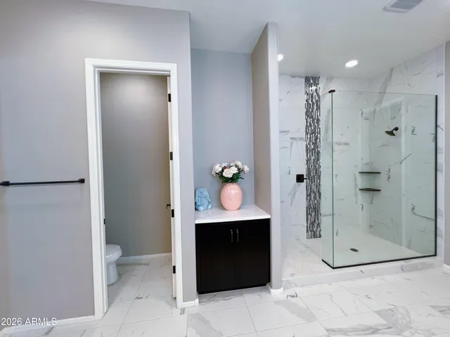 a view of empty room with a large window