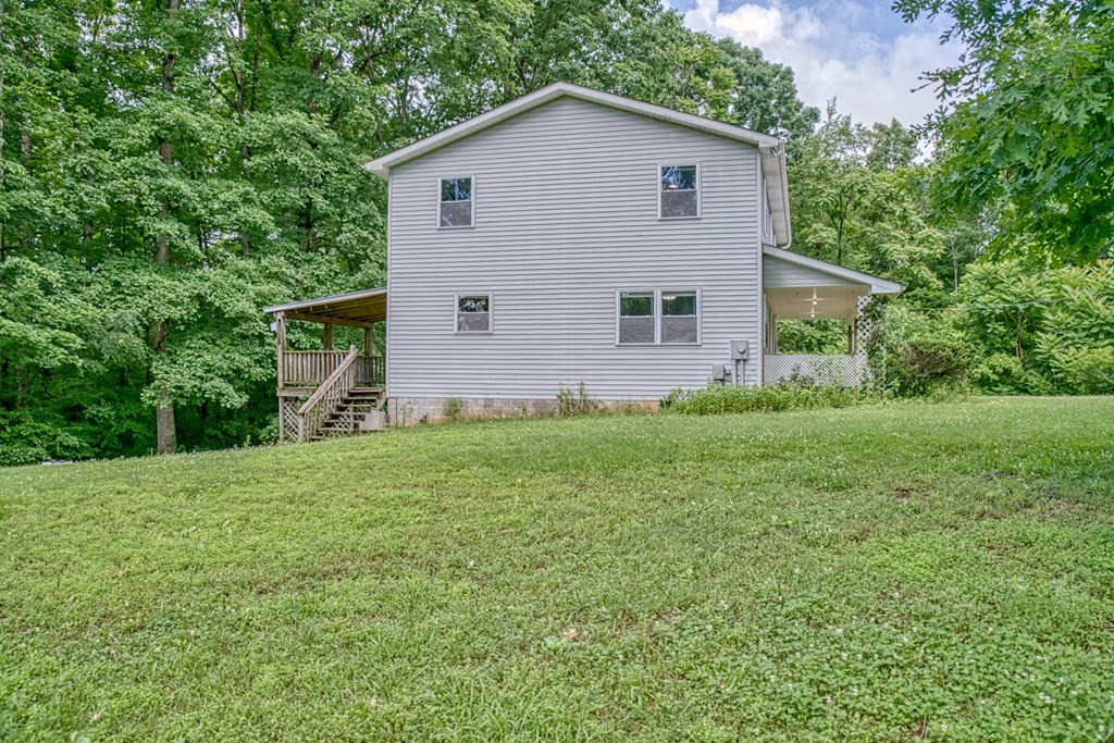 541 Bennett Road Sparta, TN 38583 - Photo 25 of 27 a view of a backyard with plants and large tree