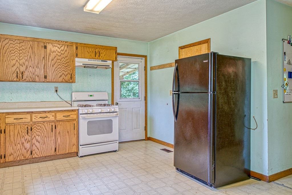 541 Bennett Road Sparta, TN 38583 - Photo 8 of 27 a kitchen with a refrigerator sink and cabinets