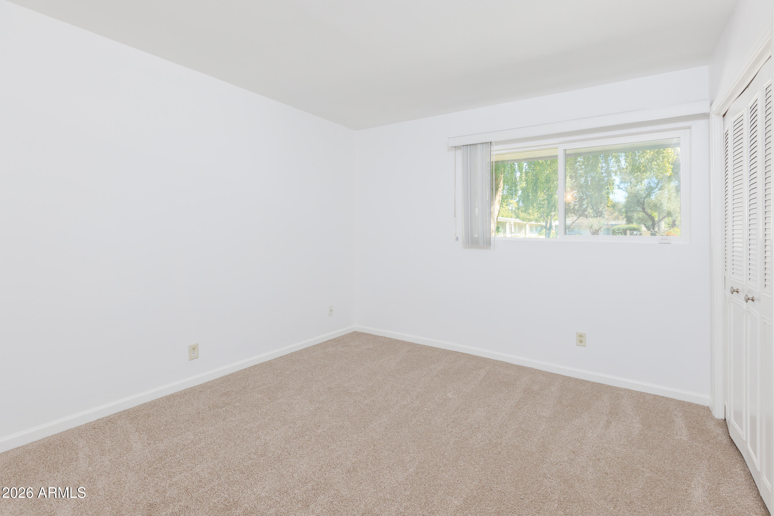 5550 North 12th Street, Unit 8 Phoenix, AZ 85014 - Photo 12 of 25 an empty room with a window