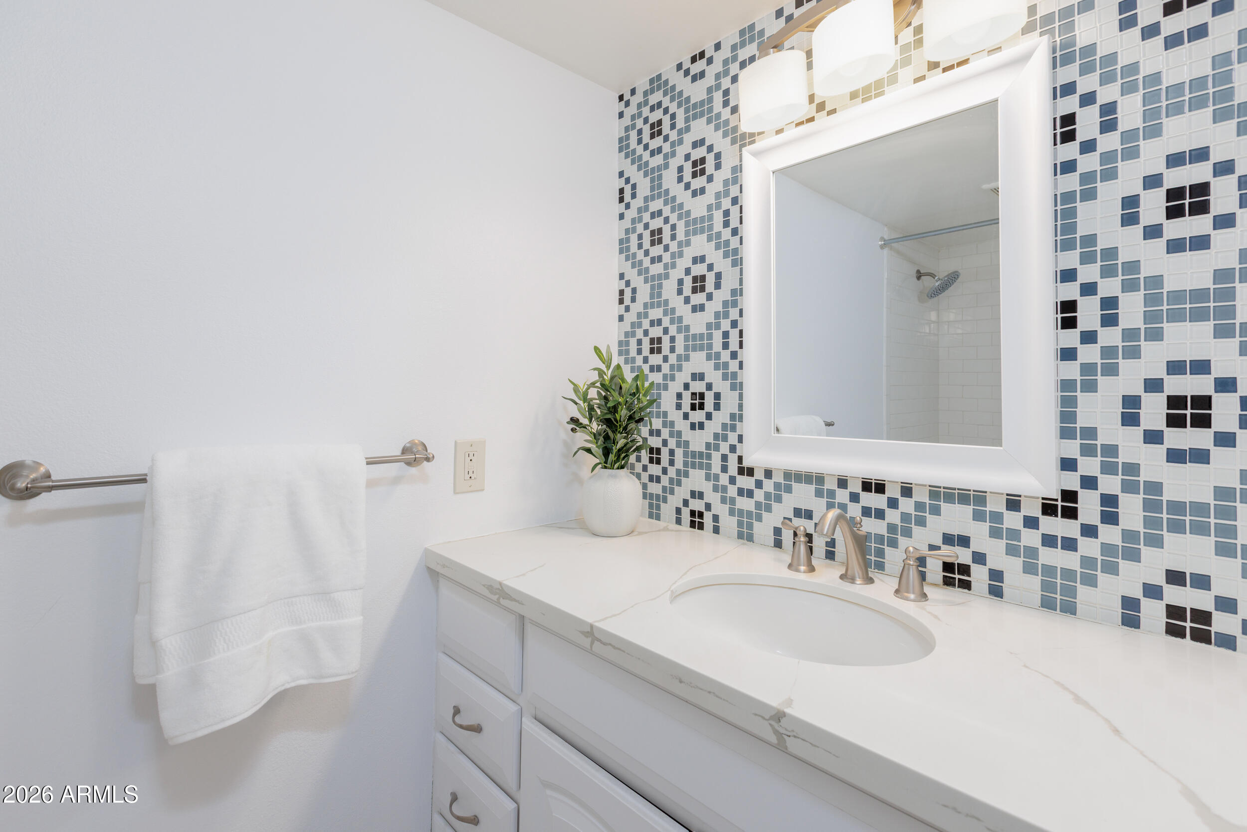 5550 North 12th Street, Unit 8 Phoenix, AZ 85014 - Photo 14 of 25 a bathroom with a sink and a mirror