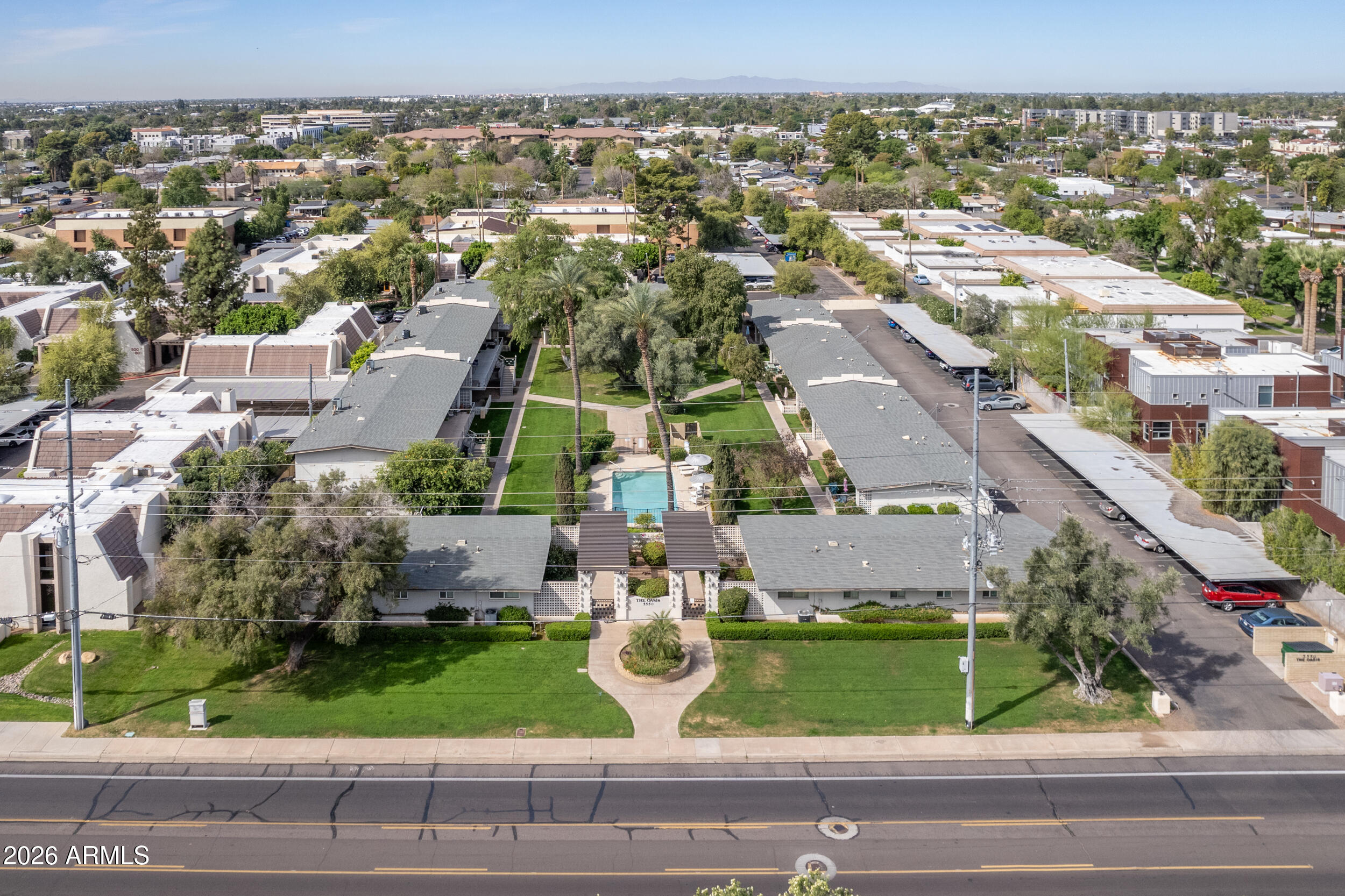 5550 North 12th Street, Unit 8 Phoenix, AZ 85014 - Photo 21 of 25 an aerial view of residential houses with outdoor space and parking